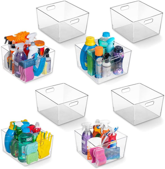 Clear storage bins with colorful items on a white background