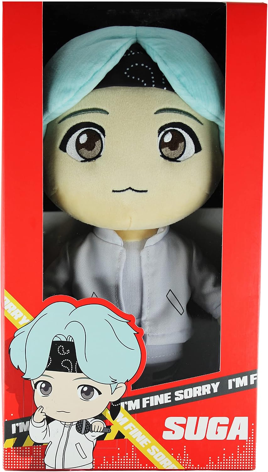 Plush toy with light blue hair and black headband in packaging, featuring text 'I'm fine sorry I'm fine' and brand name 'Suga'.