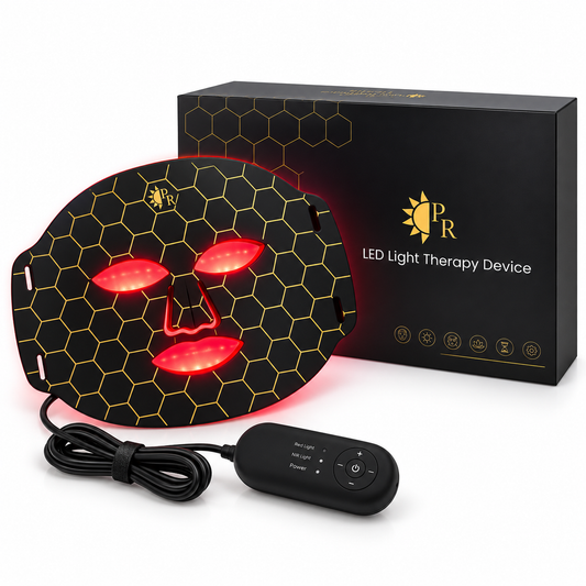 Black LED light therapy face mask with a yellow honeycomb pattern and glowing red light, shown with its black remote control and branded retail box on a white background.
